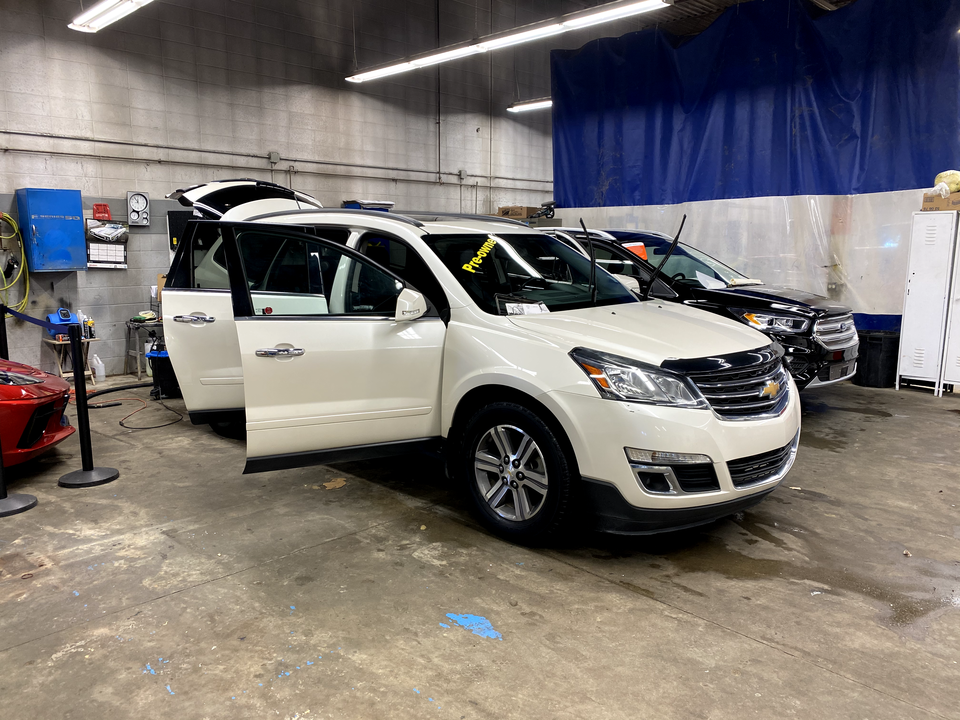White SUV being repaired at Wheaton Collision