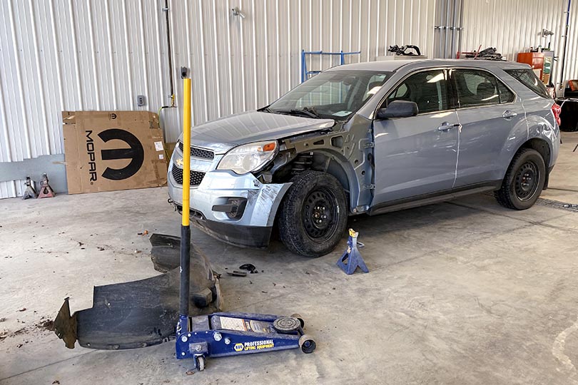 SUV being repaired in the Wheaton Collision body bay